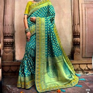 New silk teal and green saree with unsewn blouse piece.